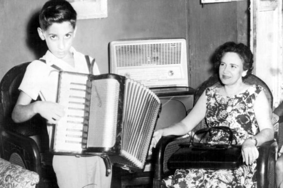Emilio plays the accordion