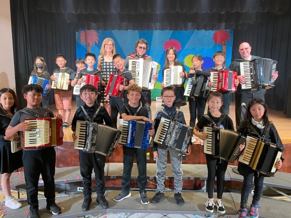 Cory Pesaturo with young accordionists