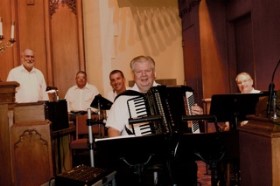 From L to R: Theron Strike, pianist and Music Director at the church;drummer Phil Snow; on the right is tuba player Mike Goldberg